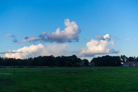 Interesting cloud formations in  the sky while the blue of the sky is still v Stock Photos