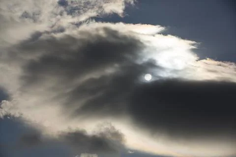 Interesting cloud patterns over the Lake District, UK, with rainbow patterns. Stock Photos