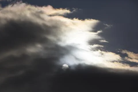 Interesting cloud patterns over the Lake District, UK, with rainbow patterns. Stock Photos