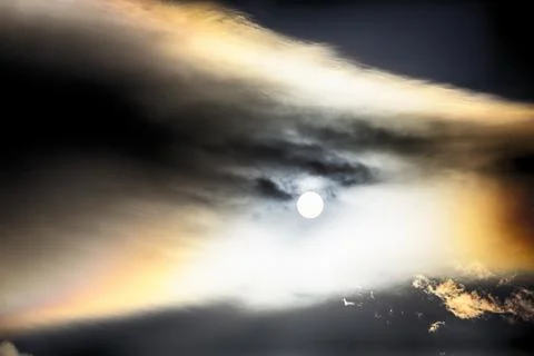 Interesting cloud patterns over the Lake District, UK, with rainbow patterns. Stock Photos