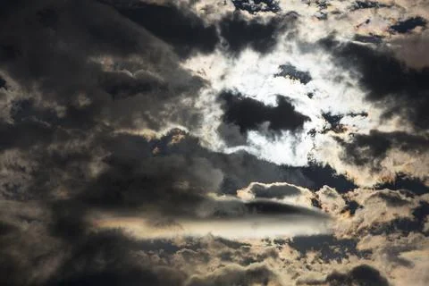 Interesting cloud patterns over the Lake District, UK, with rainbow patterns. Stock Photos