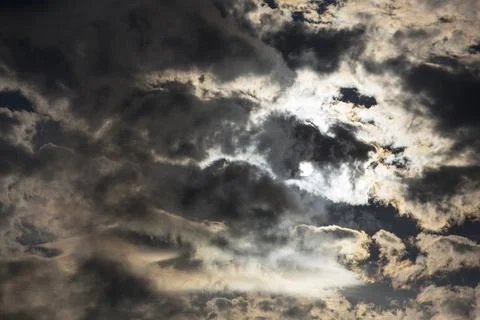 Interesting cloud patterns over the Lake District, UK, with rainbow patterns. Stock Photos