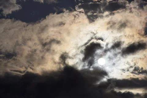 Interesting cloud patterns over the Lake District, UK, with rainbow patterns. Stock Photos