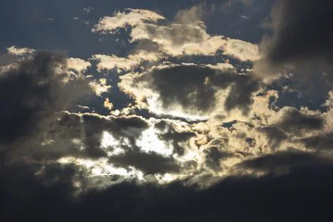 Interesting cloud patterns over the Lake District, UK, with rainbow patterns. Stock Photos