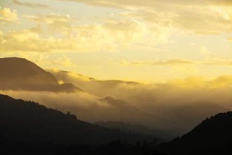 Interesting cloud patterns over Wetherlam, Lake District, UK, at sunset. Stock Photos