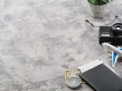 Interesting composition on a gray background. Compass, passport, tickets, cam Stock Photos