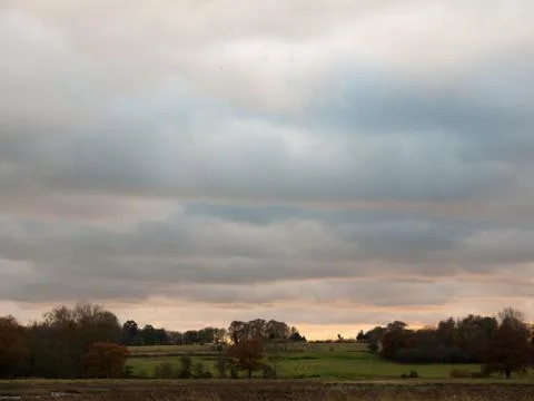 Interesting dramatic clouds open countryside plain background landscape Stock Photos