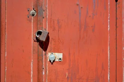 Interesting locks of the garage door.	 Stock Photos