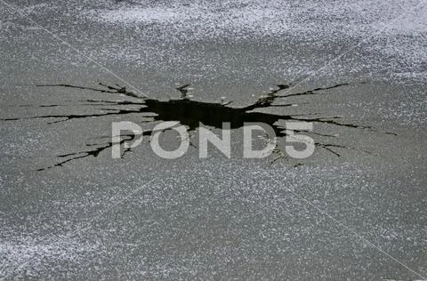 Interesting natural background of thawing at frozen lake Stock Photos