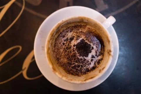 Interesting pattern for magician in a cup of coffee on table in coffee shop cafe Fotos de archivo