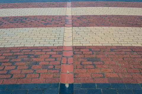 Interesting pattern of red black and beige bricks 스톡 사진
