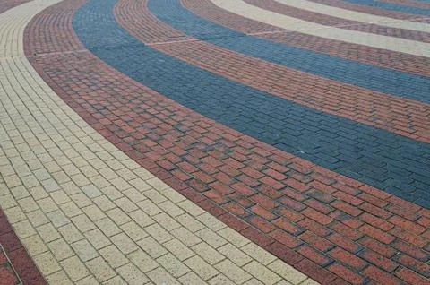 Interesting pattern of red black and beige bricks 스톡 사진