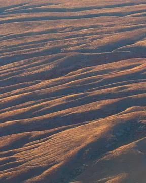 Interesting pattern of sediment in the desert during sunrise Photos