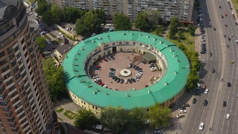 Interesting round shape of the building with a green roof Stock Footage 126161367