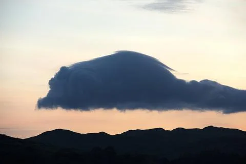 Interesting shaped clouds at sunset over Ambleside, Lake District, UK. Foto stock