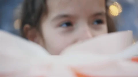 Interesting timelapse video of pretty kid stealing a gift box from under the Stock Footage 119045212