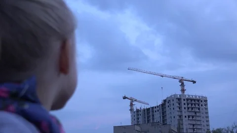 Interesting Young Lady Looking an Building Cran Working. 4K UltraHD, UHD Stock Footage 82678318