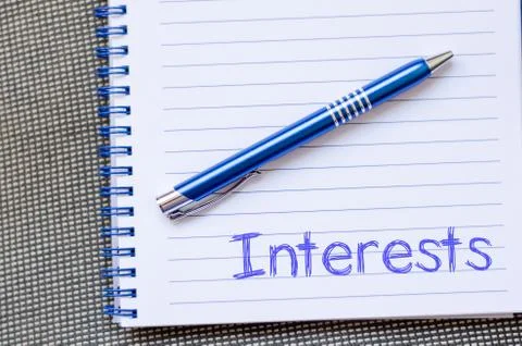 Interests write on notebook Stock Photos