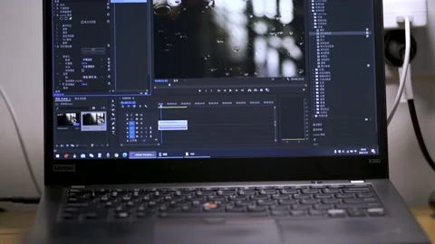 The interface of Adobe Premiere CC is displayed on the screen of a laptop Stock Footage 156804884