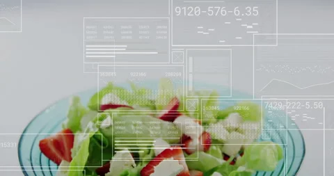 Interface panels floating as glass salad bowl rising revealing ingredients while Stock Footage 311949443