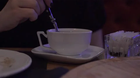 Interfere With a Spoon in a Cup of Tea Stock Footage 58446478
