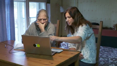 Intergenerational Duo Focused on Learning Laptop Skills in Cozy Room. Stock Footage 320326976