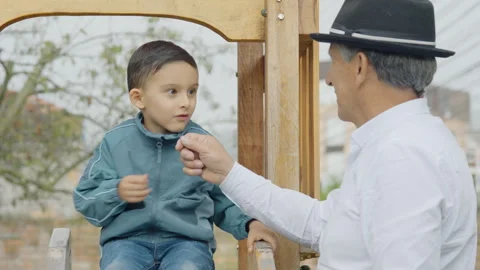 Intergenerational play in the garden at home Stock Footage 310998733