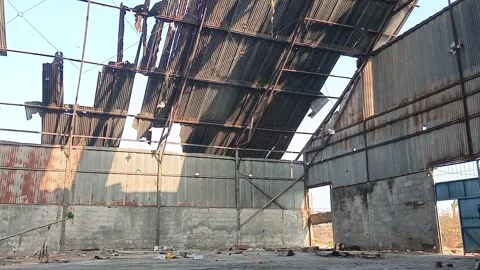 Interior of Abandoned Factory Warehouse with Broken Corrugated Roof Видео 346384742