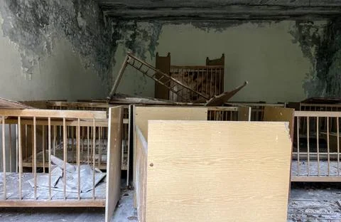 Interior of an abandoned kindergarten in the Pripyat ghost town, Chernobyl ex Stock Photos