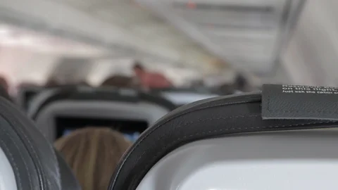 Interior Of Airplane With Passengers from behind Stock Footage 104151313