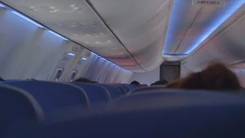 Interior of airplane with passengers on seats during flight. Stock Footage 123745952