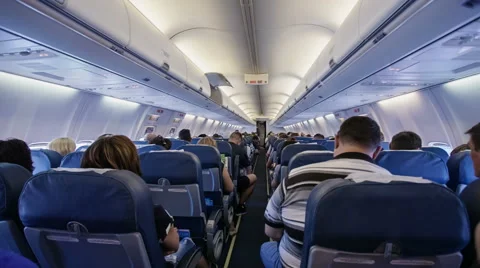 Interior of airplane with passengers on seats Stock Footage 51215149