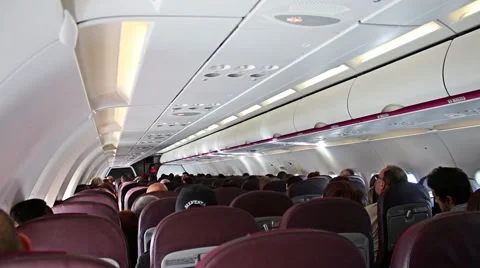 Interior of airplane with passengers on seats Stock-Footage 58129780
