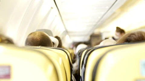 Interior of airplane with passengers on seats Stock Footage 65212636