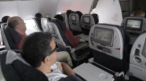 Interior airplane, point of view as passenger from coach seats as travelers depa 動画素材 53622923