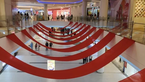 The interior ambience of the modern mall features red wrapped decorations Stock Footage 302367348