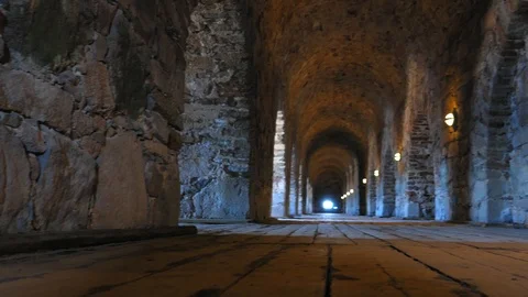 Interior of Ancient Castle Corridor with Stone Walls and Wooden Floor Stock Footage 116411943