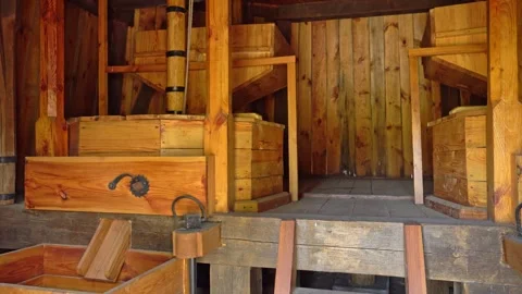 The interior of an ancient grain mill. Flour production in the old days Windmill Stock Footage 244810392