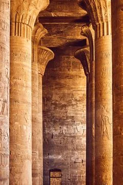 Interior of ancient temple in Egypt. Pillars with Egyptian hieroglyphs. Pop.. Stock Photos