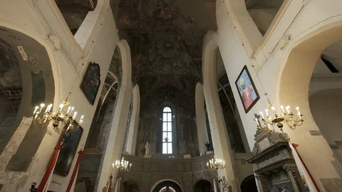 Interior Of Ancient Temple. Sun's Rays Illuminate The Icons And Ancient Frescoes Video stock 110746633