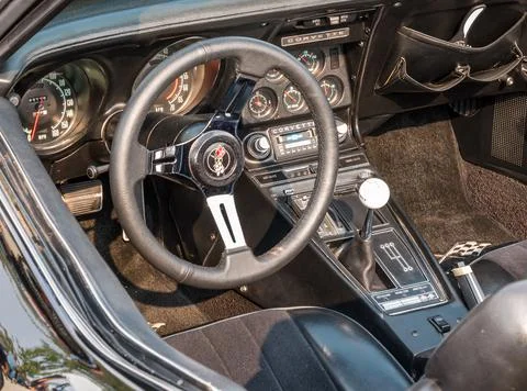 The interior and steering wheel of a vintage Chevrolet Corvette convertible Stock Photos