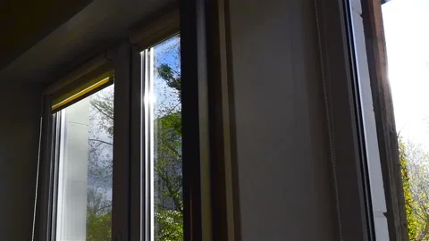 Interior of the apartment. Large windows in the room. Sun rays. Camera in motion Stock Footage 91618384