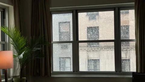 Interior apartment view snowing outside window winter New York City NYC Stock Footage 148126987