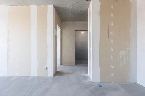 Interior of the apartment without decoration in gray colors Stock Photos