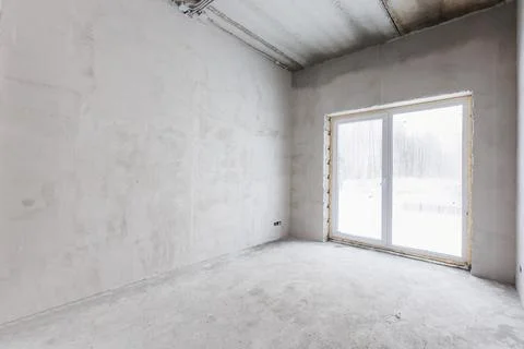 Interior of the apartment without decoration in gray colors. rough finish Stock Photos