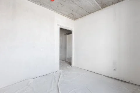 Interior of the apartment without decoration in gray colors. rough finish Stock Photos