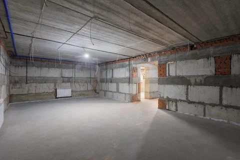 Interior of the apartment without decoration in gray colors. rough finish Stock Photos