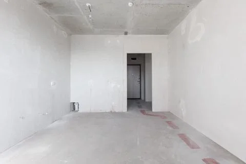 Interior of the apartment without decoration in gray colors. rough finish Stock Photos