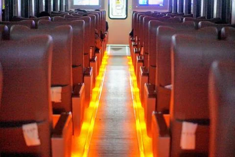 The interior atmosphere inside an executive class train carriage featuring rows Stock Photos