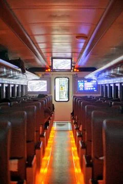The interior atmosphere inside an executive class train carriage featuring rows Stock Photos